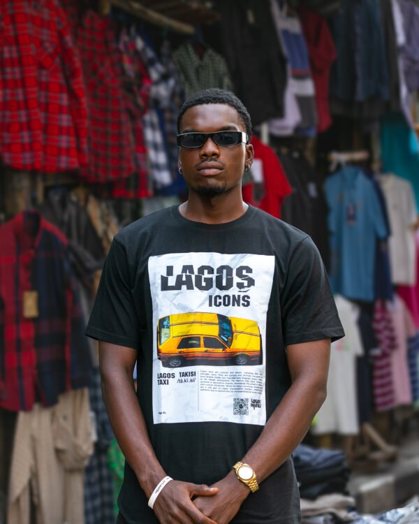 A model wearing Lagos Icons Taxi shirt by Lagos Prints